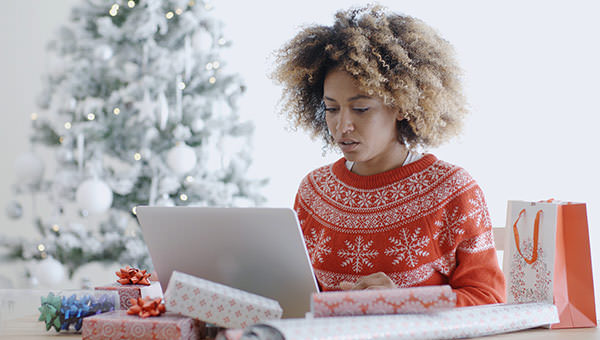 bigstock-Young-woman-using-a-laptop-at--109632098